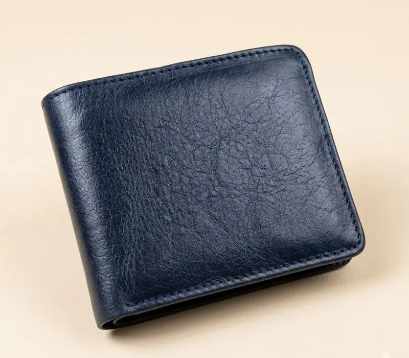 Blue leather wallet on a beige background