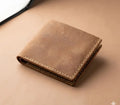 Brown leather wallet on a matching brown background