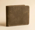 Brown leather wallet on a beige background