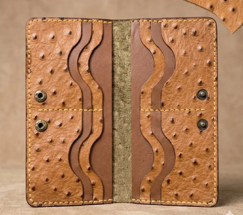 Brown leather wallet with textured design on a beige background