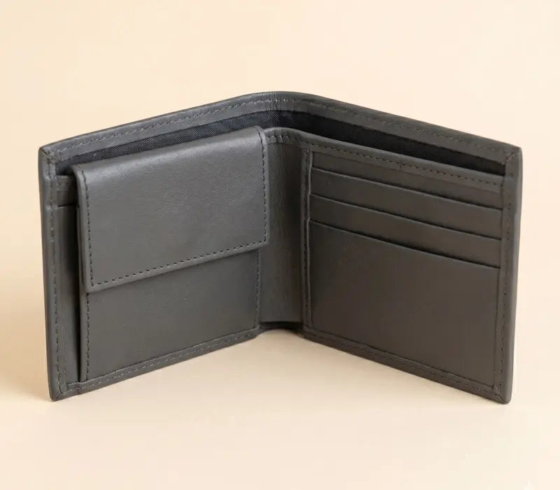 Gray leather wallet open on a beige background