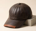 Brown leather cap on a beige background