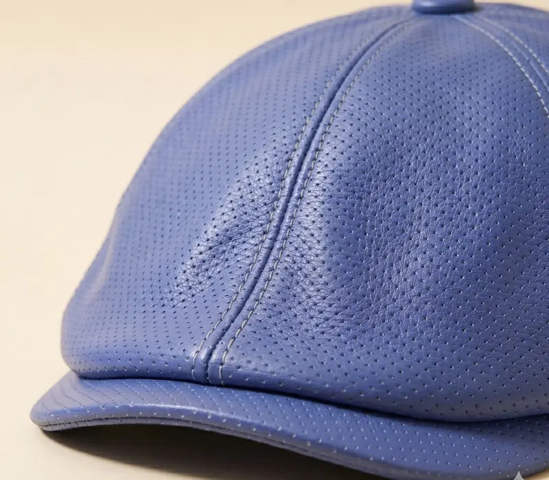 Blue textured cap on a beige background