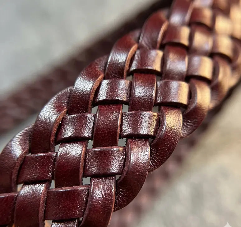 Close-up of a braided brown leather strap